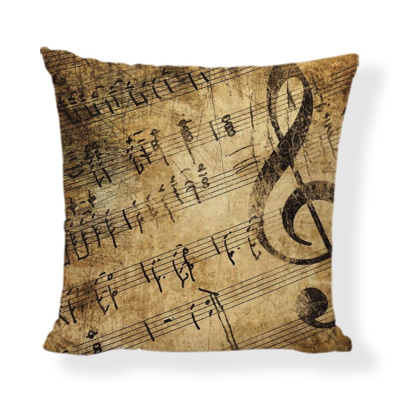 An elegant 45x45cm linen cushion cover featuring printed musical instruments, including a violin, piano, and trumpet.